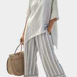 Комплект Дейзи с асиметрична блуза и райе панталони за модерен и елегантен стил